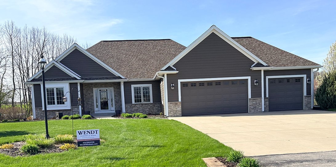 Beautiful home exterior with new windows and doors installed